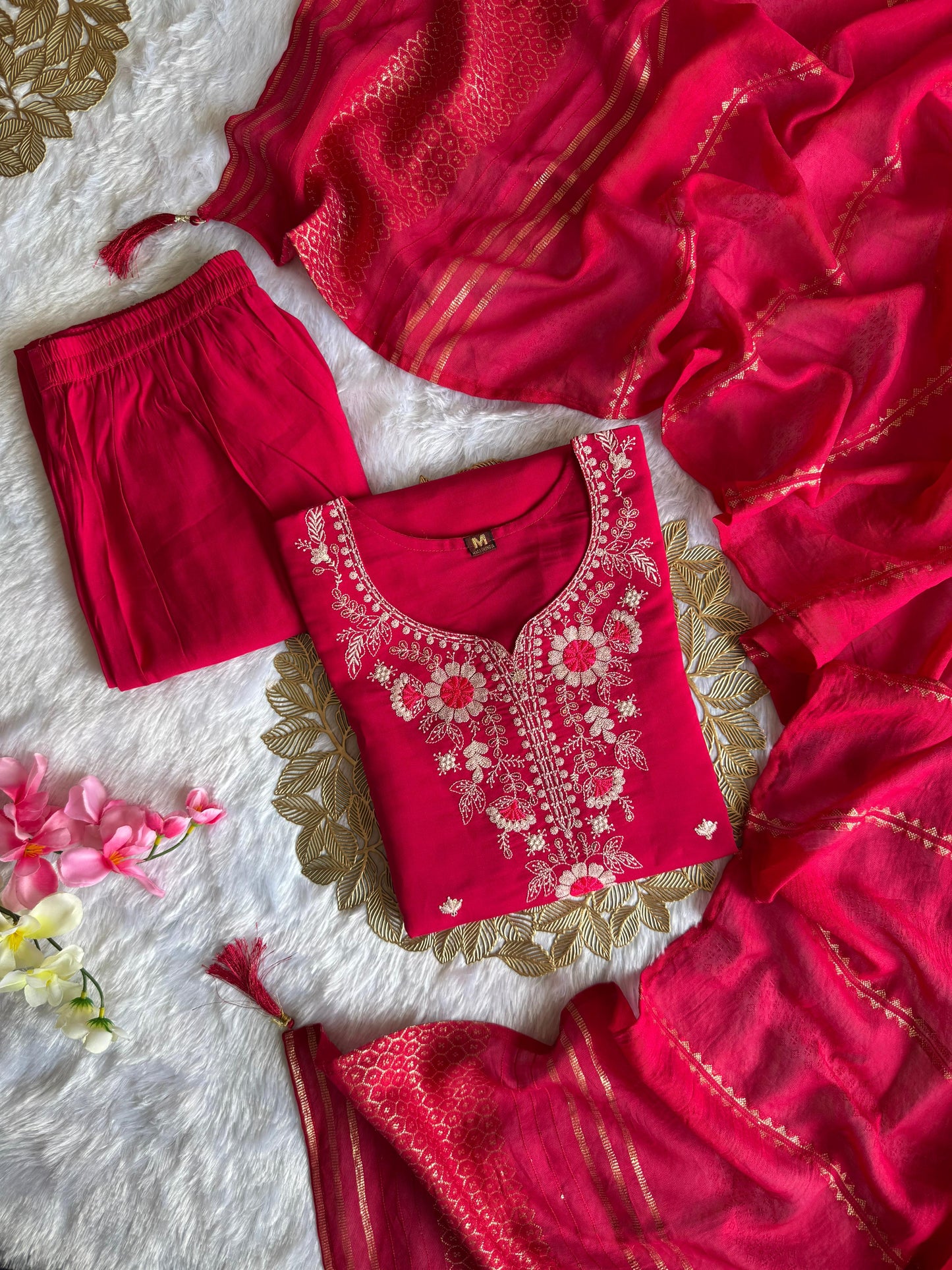 Intricate embroidery with sequins adds festive sparkle